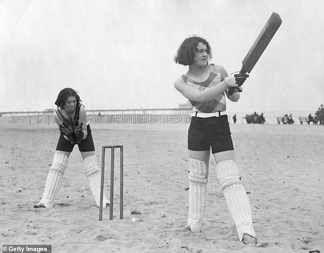 Young women are photographed playing cricket on the beach in 1926. Seasidehistory.co.uk reveals that 'there was a huge jump in the number of people able to take a holiday by the sea' in the 1920s