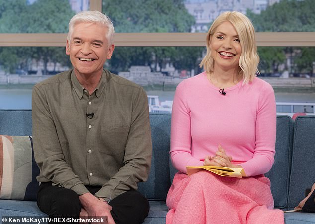 Holly is arguably best known for having fronted This Morning alongside Phillip Schofield (pictured left) from 2009 until 2023