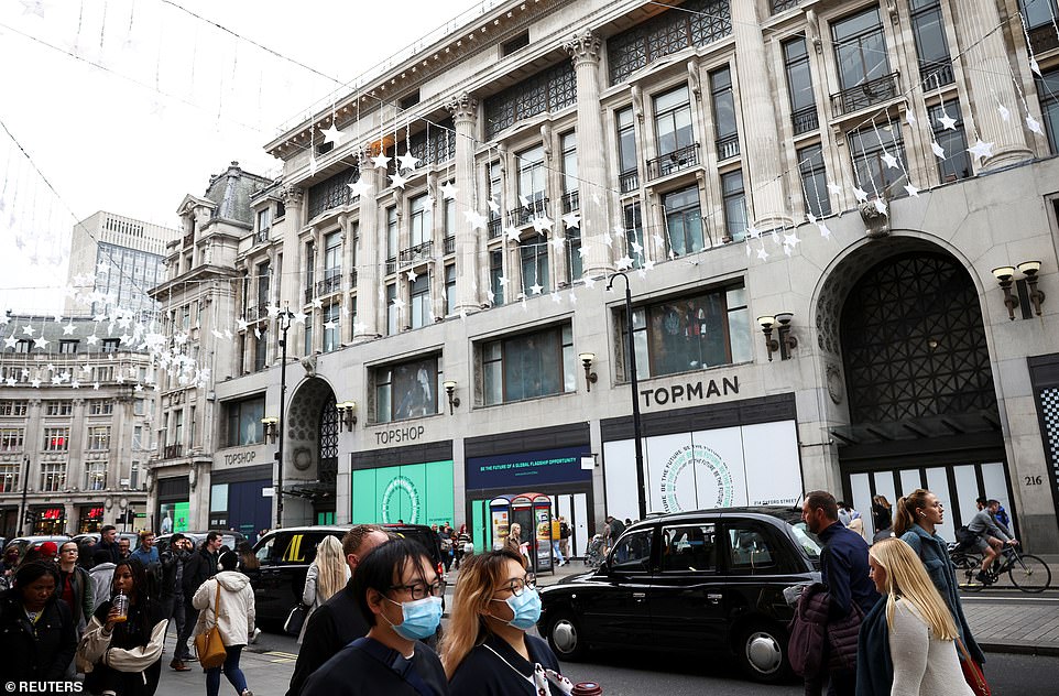 OCTOBER 2021: People walk past 214 Oxford Street after Topshop's flagship store was closed