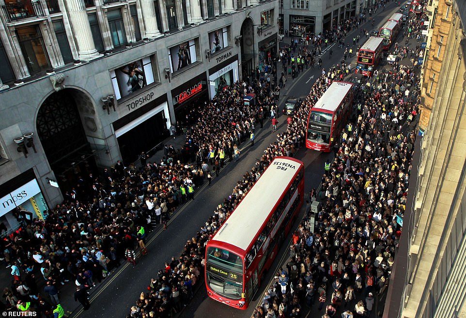 APRIL 2014: Crowds outside Topshop on Oxford Street waiting for model Kate Moss to arrive