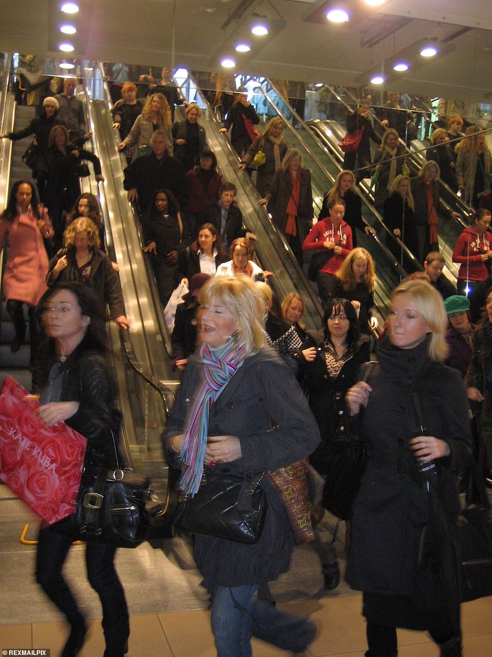 APRIL 2006: Crowds of shoppers rush down the escalators at the Topshop store on Oxford Circus