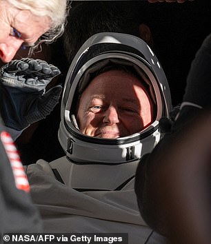 BEFORE: Butch Wilmore being carried out of the SpaceX Crew Dragon capsule