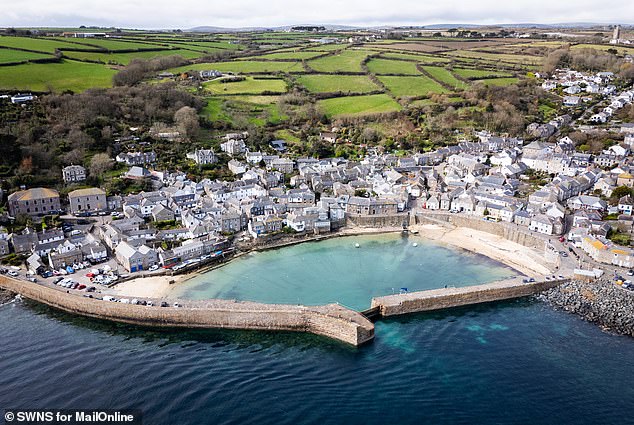 Mousehole (pictured last week) is thought to be the second home capital of Britain