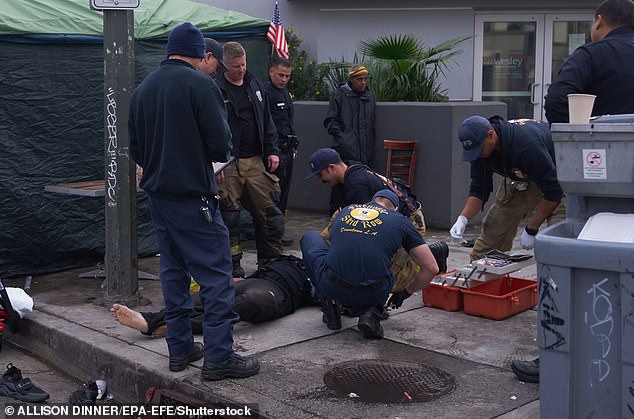Police help a man believed to have overdosed in Los Angeles