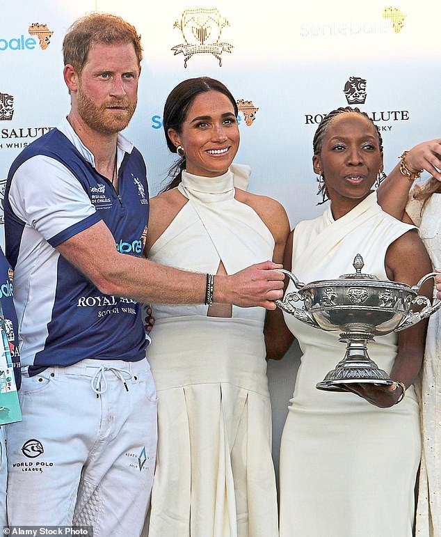 Dr Sophie Chandauka, pictured with Meghan and Harry at a polo event last year that sparked a row. A year on the trio have fallen out and the Duke of Sussex resigned from Sentebale