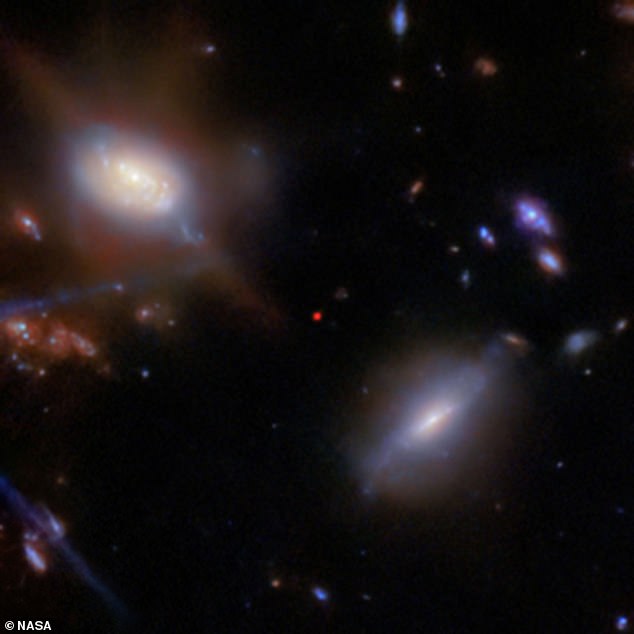 The red dot at the center of this image is the ancient galaxy JADES GS-z13-1, captured by NASA's James Webb Space Telescope (JWST)