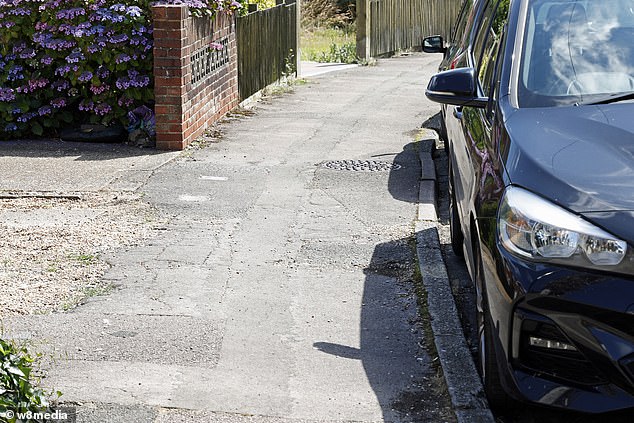 Wheely annoying: A This is Money reader's neighbour sells used cars from outside his house