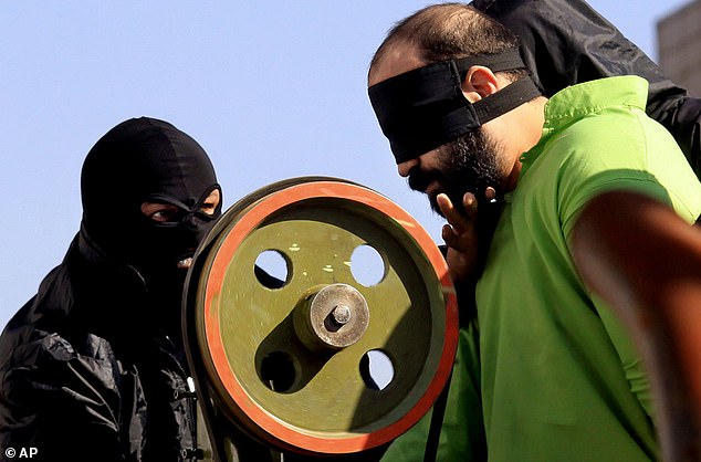 Iranian authorities are preparing to amputate the fingers of three prisoners convicted of theft. File image: Authorities carry out the court-ordered amputation of the fingers of a convicted thief in a public square in the southern Iranian city of Shiraz, Thursday, Jan. 24, 2013