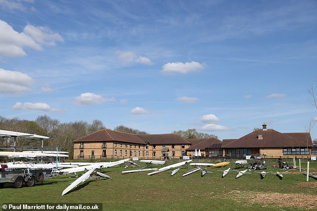 Rowing boats are in front of The Dragonfly Hotel in Cambridgeshire