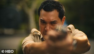 The hotel's security guard Gaitok (Tayme Thapthimthong) shoots him in the back.
