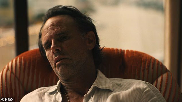 Rick wakes up in a hotel room chair as Frank is heard in the next room, still partying with the women they picked up last night