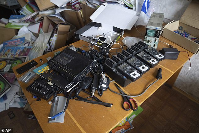 Electronic equipment sits on a table in a building Ukrainian civilians said they were detained and tortured by Russian soldiers in Kherson, Ukraine