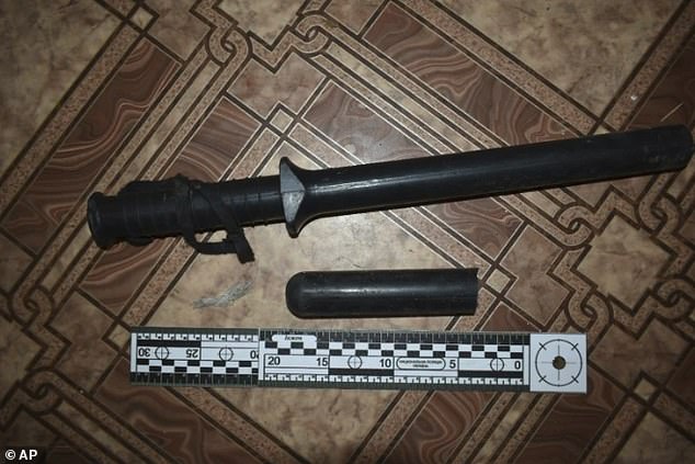 This photo provided by Ukrainian investigators in 2023 shows a baton found a building used by Russian forces in Izium, Ukraine