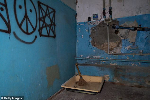 A general view of the basement and rooms as officers of the War Crimes Prosecutor office and police officers investigate war crimes committed by the Russian occupying forces in Kherson