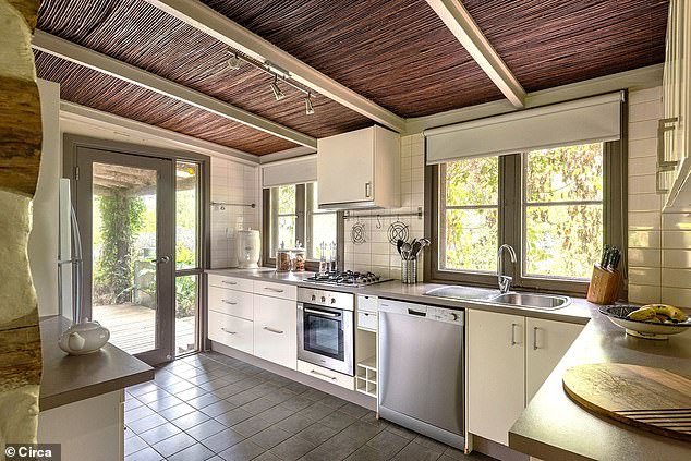 Another standout is the enormous Australian-style shed - timber and iron-clad, with vast east and west-facing doors that capture breathtaking views