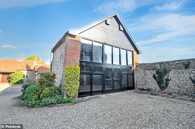 The rustic property comes with two outbuildings and a large walled garden