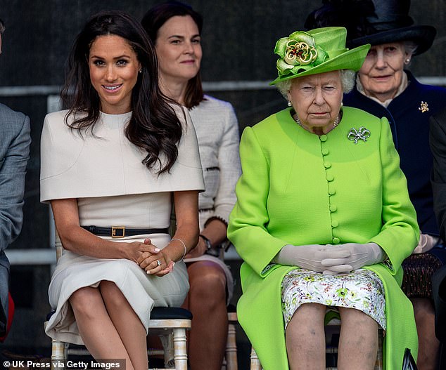 Meghan with the Queen during an event  in June 2018. A profile of the Duchess of Sussex said the  Meghan would reportedly be 'warm and effusive' towards employees at the start before turning 'cold and withholding toward the person she perceived to be responsible'