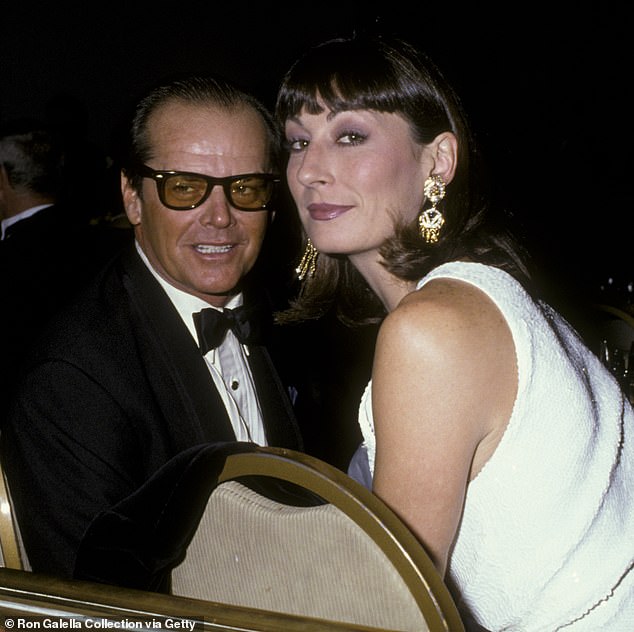 Anjelica Huston - who dated Jack Nicholson the longest of all his exes between 1973-1990 - revealed she's 'in the clear' after a secret, shocking 'bout with cancer' that was discovered in May 2019 (pictured in 1986)