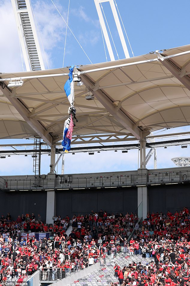 Sale's Champions Cup last 16 match against Toulouse was delayed by 40 minutes when a parachutist was caught on the roof while trying to land on the pitch