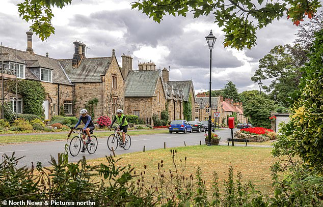 Cyclists pass through Brancepeth, County Durham
