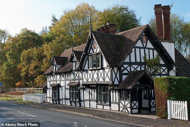 A traditional black and white timber-framed cottage in Ombersley