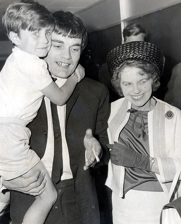 Jimmie Nicol is seen here with his mother and his son Howie after arriving back at Heathrow airport in west London in 1964 after his Beatles stint finished