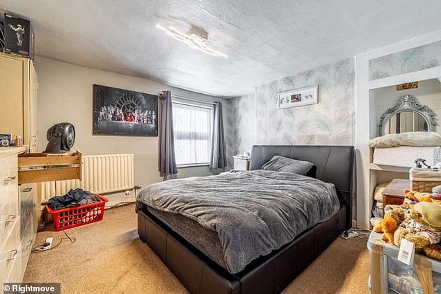 One of the bedrooms also follows the same grey, minimalist vibe as the rest of the house