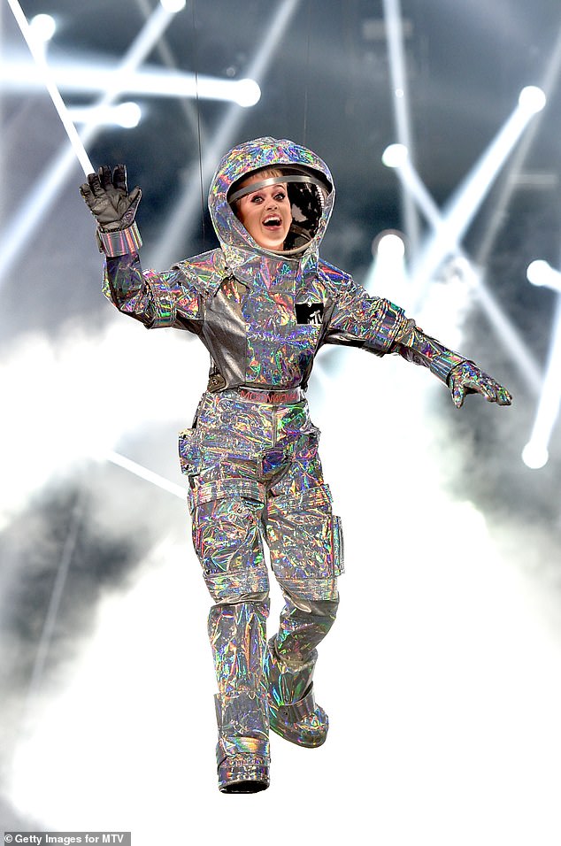 The Roar hitmaker (pictured in 2017) also said she has been 'psychologically' preparing for the spaceflight by reading work from the late Carl Sagan and other scientists