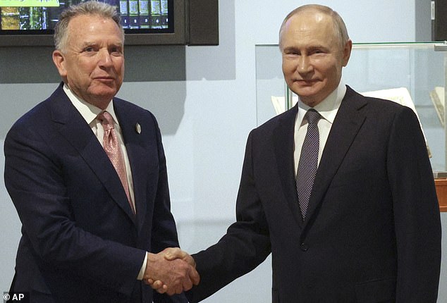 US envoy Steve Witkoff (L) and Russian President Vladimir Putin shake hands after an hours-long meeting on Friday