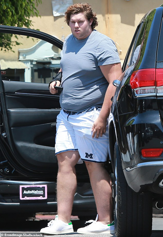 While big brother Patrick, 31, has been flaunting his physique on The White Lotus , Christopher, 27, let his progress do the talking in a snap; (seen in 2018)