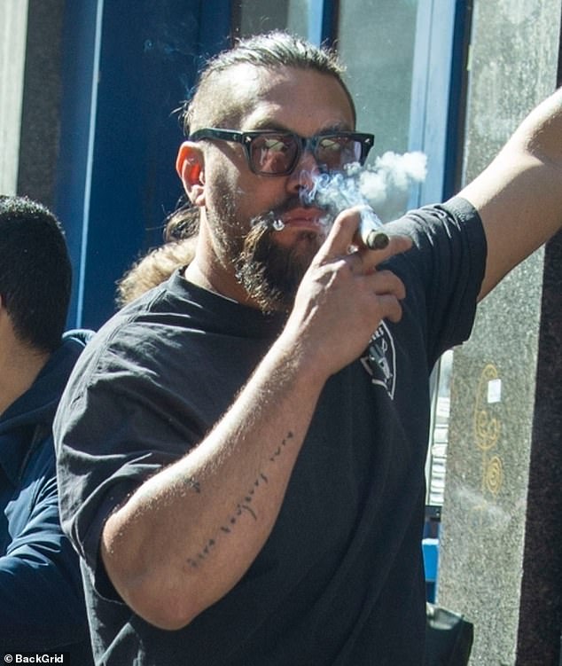 A huge Hollywood actor was spotted puffing on a cigar in London when he joined the locals in SOHO on Friday