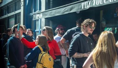 Two women were seen sneaking a selfie of the celebrity outside a pub in Soho