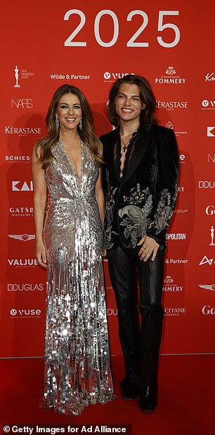 She boosted her height in matching heels and accessorised with eye-catching diamond drop earrings and a bracelet