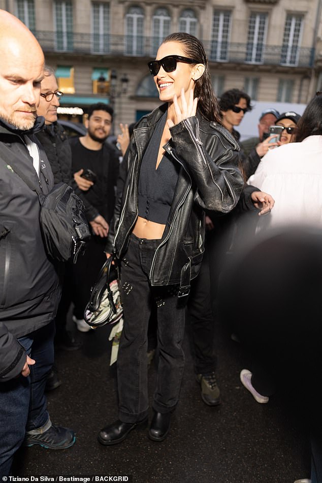 Bella Hadid, 28, looked incredible in black leather as she posed for snaps with fans after she filming for the upcoming FX series The Beauty in Paris on Saturday