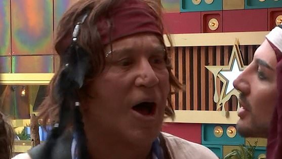 Mickey Rourke in pirate outfit yelling at housemate