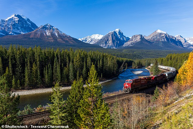 During the whirlwind trip, passengers will visit dozens of UNESCO World Heritage sites across three continents (pictured: Banff National Park, Canada)