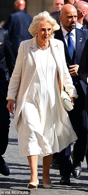 Twenty years later on her wedding anniversary in        Italy, she wore the same coat
