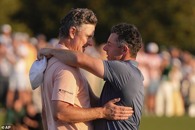 Justin Rose hugs Rory McIlroy after losing a play-off for the Masters title at Augusta on Sunday