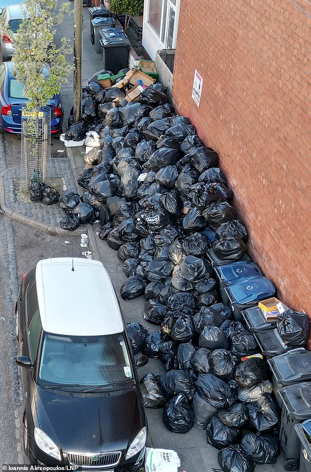 Labour was humiliated by its top union backer on Monday as bin workers voted to prolong crippling strikes in Birmingham (Pictured: Uncollected rubbish fills the streets in Balsall Heath)