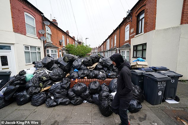 Rubbish bags pile high on Poplar Road, King's Heath, yesterday