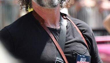 A former child actor turned photographer was spotted in his element at Bernie Sander's Oligarchy rally in downtown Los Angeles