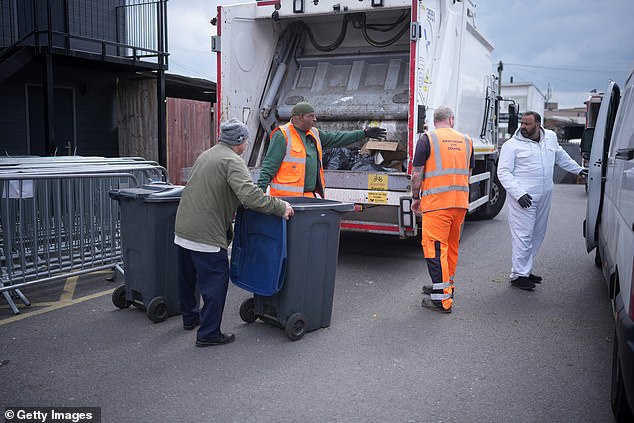 Residents take their rubbish to a collection point at Green Lane Mosque as Birmingham council refuse collectors continue their strike on April 15, 2025 in Birmingham, England