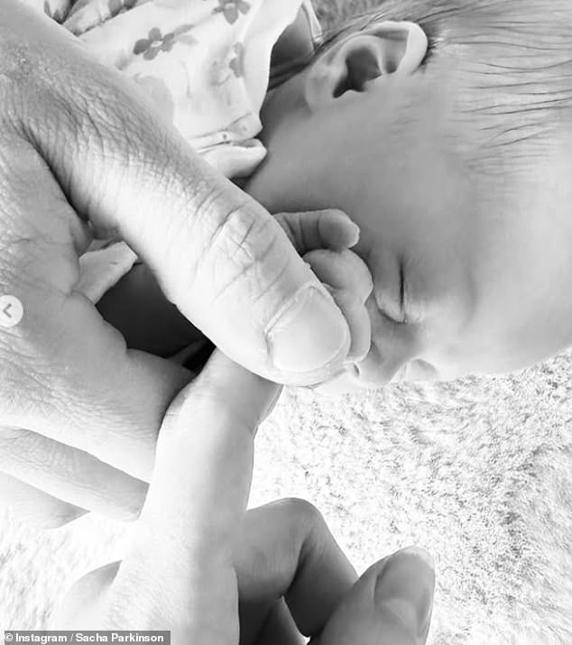 Sacha took to Instagram to share two sweet black and white snaps of her baby daughter