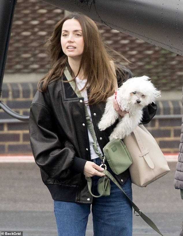 The 62-year-old action star and the 36-year-old actress were spotted at an airport after getting out of Tom's helicopter - after returning from Madrid, Spain