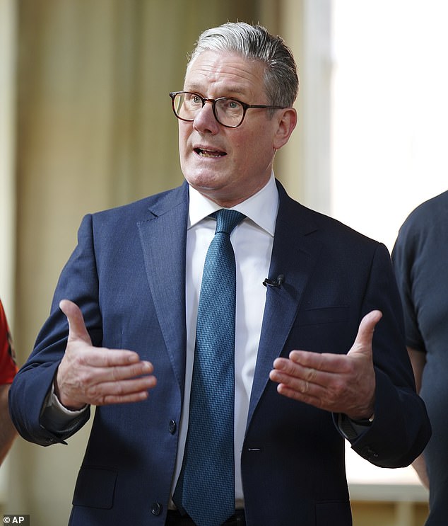 Britain's Prime Minister Keir Starmer speaks during a visit to meet British Steel workers in Appleby Village Hall near Scunthorpe, Lincolnshire, Saturday April 12, 2025