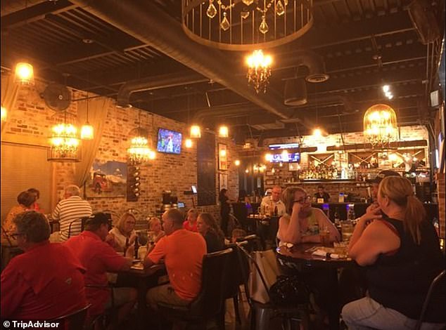 Business as usual: Guests in Perikas, the main restaurant in Seminole. It was packed when I visited, and there wasn't a single sign warning about measles in sight