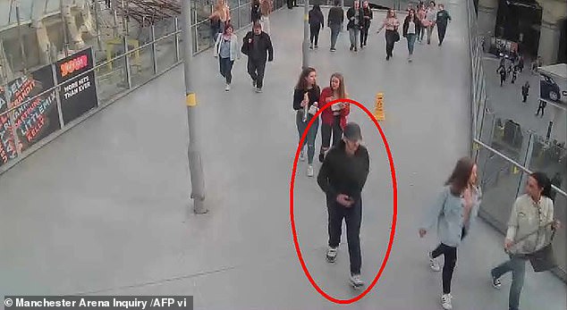 Salman Abedi pictured walking towards the Manchester Arena before the concert