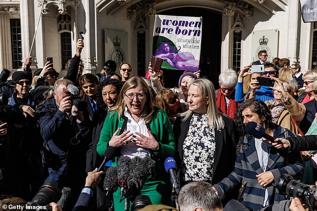 In a long-awaited judgment delivered on Wednesday, the UK's highest court confirmed the terms woman and sex in the 2010 Equality Act 'refer to a biological woman and biological sex'. Pictured: Susan Smith (L) and Marion Calder, directors of 'For Women Scotland' speak to the media outside the Supreme Court