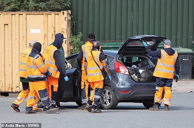 Seven staff members were seen unloading rubbish from a single car on Sunday morning