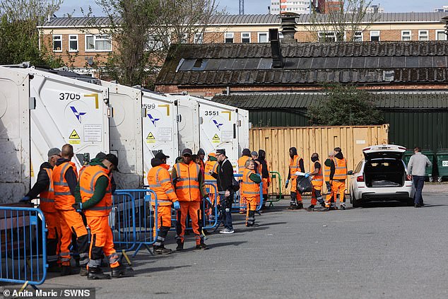 People dispose of their rubbish using a mobile refuse collection service at Birmingham Central Mosque Car Park, Birmingham